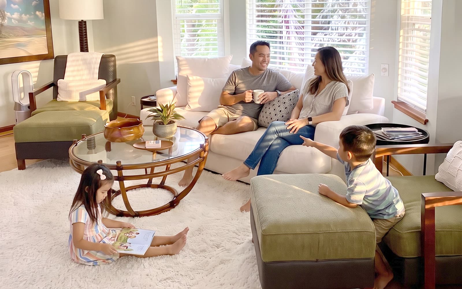The same living room boosted: sunlit, bright, a family on the sofa