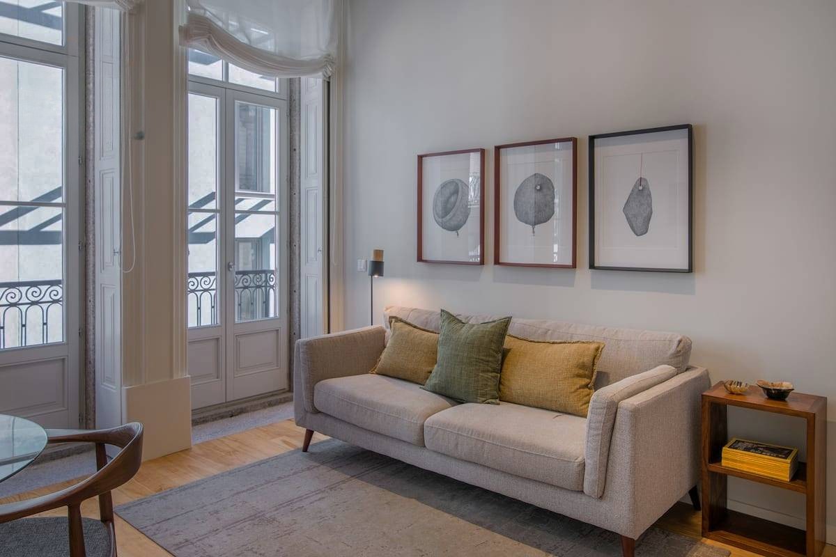 Dim living room with a dark sofa and closed-in light, from BNB Boost's public gallery